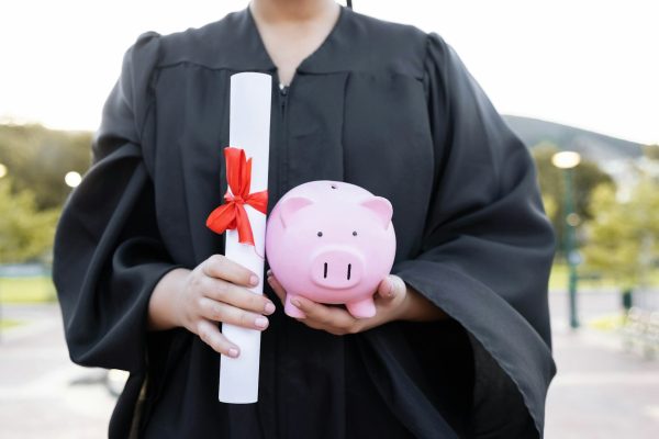 Piggy bank, saving and university diploma in hands of woman graduate with education scroll. Study p